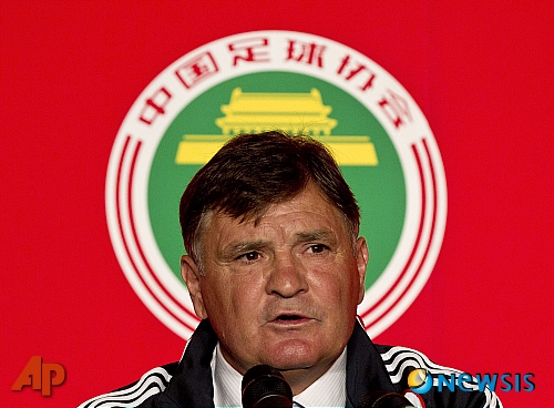 Jose Antonio Camacho speaks during a news conference in Beijing, China, Sunday, Aug. 14, 2011. Former Spain coach Camacho will lead China's national team in the qualification run-up to the Brazil World Cup soccer tournament. (AP Photo/Andy Wong)