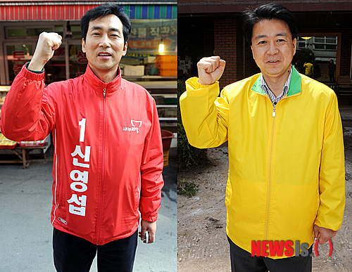 【서울=뉴시스】조성봉 기자 = 제19대 국회의원 선거 격전지인 마포 갑 신영섭(왼쪽) 새누리당 후보와 노웅래 민주통합당 후보가 5일 오후 서울 마포구 공덕동 인근에서 파이팅을 외치며 지역주민들에게 지지를 호소하고 있다. suncho21@newsis.com