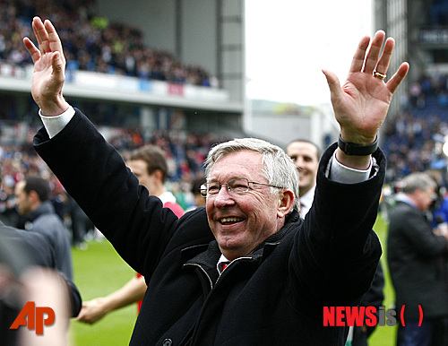 FILE - This is a Saturday May 14, 2011 file photo of Manchester United manager Alex Ferguson as he celebrates after Manchester United won the English Premier League at Ewood Park, Blackburn, England . Alex Ferguson is retiring at the end of the season it was announced Wednesday May 8, 2013, bringing a close to a trophy-filled career of more than 26 years at Manchester United that established him as the most successful coach in British football history. (AP Photo/Tim Hales, File)