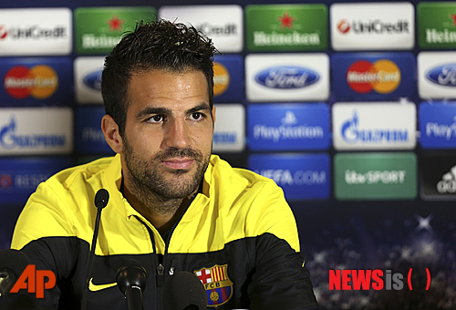 FILE - A Monday, Sept. 20, 2013 photo from files showing Barcelona's Cesc Fabregas talking to the media during a press conference at Celtic Park, Glasgow, Scotland. Chelsea has announced on its website the signing of Cesc Fabregas from Barcelona on a five-year deal. The 27-year-old Fabregas, who has previously played for Chelsea?s London rival Arsenal, says ?I do feel that I have unfinished business in the Premier League? and that Chelsea ?match my footballing ambitions with their hunger and desire to win trophies.? Fabregas, who is currently with Spain preparing for the World Cup in Brazil, will wear the number four shirt at Chelsea.(AP Photo/Scott Heppell, File)