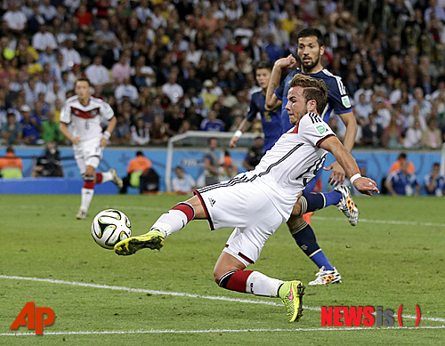 Germany's Mario Goetze kicks to score his side's first goal in extra time during the World Cup final soccer match between Germany and Argentina at the Maracana Stadium in Rio de Janeiro, Brazil, Sunday, July 13, 2014. (AP Photo/Felipe Dana)