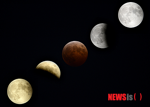 【서울=뉴시스】박상훈 기자 = 8일 서울 남산 위로 ‘개기월식’ 현상이 일어나고 있다. (사진은 순차적으로 촬영한 달들을 합성) 2014.10.08. hyalinee@newsis.com