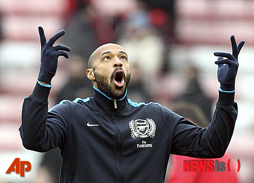 In this Saturday, Feb. 11, 2012 photo, Arsenal's Thierry Henry, is seen ahead of their English Premier League soccer match against Sunderland at the Stadium of Light, Sunderland, England. Henry has announced his retirement following a 20-year career. The 37-year-old Henry, a member of the France teams that won the 1998 World Cup and 2000 European Championship, will take up a media role as a consultant for Sky Sports channel. (AP Photo/Scott Heppell)