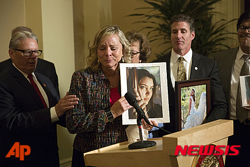 Debbie Ziegler, mother of Brittany Maynard, speaks to the media after the passage of legislation, which would allow terminally ill patients to legally end their lives, at the state Capitol, Friday, Sept. 11, 2015, in Sacramento, Calif. The measure to allow doctors to prescribe life-ending medication succeeded on its second attempt after the heavily publicized case of Maynard, the woman with brain cancer who moved to Oregon to legally take her life. (AP Photo/Carl Costas)