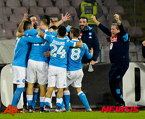Napoli's Gonzalo Higuain, second from left, celebrates with teammates after scoring a goal during a Serie A soccer match between Napoli and Inter Milan, at the San Paolo stadium in Naples, Italy, Monday, Nov. 30, 2015. (AP Photo/Salvatore Laporta)