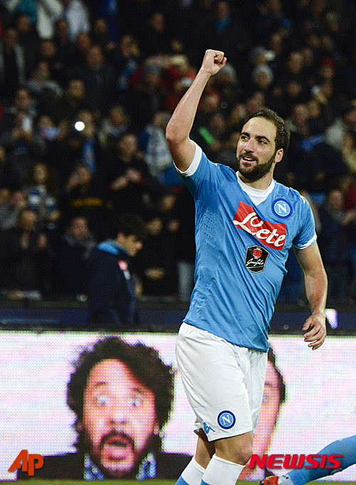 Napoli's Gonzalo Higuain celebrates after scoring his second goal during a Serie A soccer match between Napoli and Inter Milan, at the San Paolo stadium in Naples, Italy, Monday, Nov. 30, 2015. (AP Photo/Salvatore Laporta)