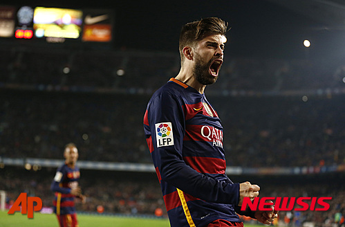 FC Barcelona's Gerard Pique reacts after scoring against Athletic Bilbao scored during a quarterfinal, second leg, Copa del Rey soccer match at the Camp Nou stadium in Barcelona, Spain, Wednesday, Jan. 27, 2016. (AP Photo/Manu Fernandez)