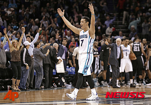 Charlotte Hornets' Jeremy Lin celebrates after an NBA basketball game against the San Antonio Spurs in Charlotte, N.C., Monday, March 21, 2016. The Hornets won 91-88. (AP Photo/Chuck Burton)
