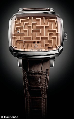 【서울=뉴시스】스위스의 시계 브랜드인 오틀랑스(Hautlence)에서 최근 '시간을 알려주지 않는' 손목시계를 출시했다. 시계판에는 시침과 분침 대신 미로게임판이 자리잡고 있다. (사진출처: 데일리메일) 2016.03.26. 