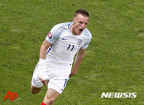 England's Jamie Vardy celebrates after scoring his side's first goal during the Euro 2016 Group B soccer match between England and Wales at the Bollaert stadium in Lens, France, Thursday, June 16, 2016. (AP Photo/Michel Spingler)