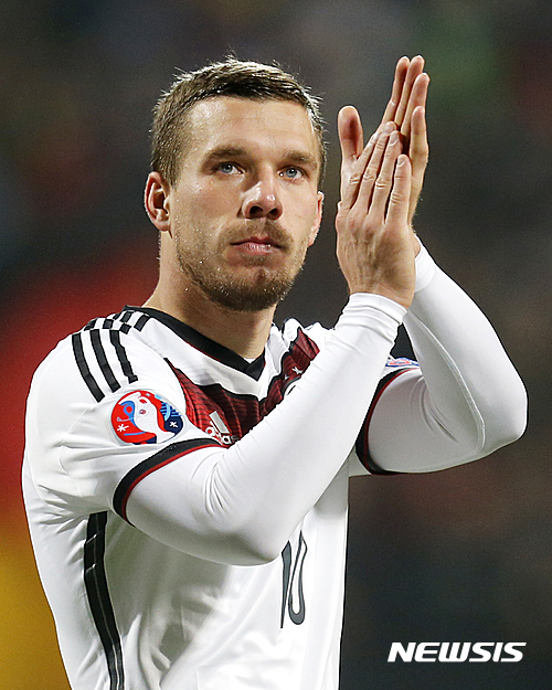 FILE - In this Nov. 14, 2014 file picture Germany's Lukas Podolski applauds after a Group D Euro 2016 qualifying match between Germany and Gibraltar in Nuremberg, Germany.&nbsp; Veteran forward Lukas Podolski has announced his retirement from Germany's national team. Podolski said in an Instagram post Monday&nbsp; Aug. 15, 2016 he had informed Germany coach Joachim Loew that he is retiring from international football with immediate effect. The 31-year-old Galatasaray player, who was born in Poland, has played 129 games for Germany over 12 years, scoring 48 goals and winning the World Cup two years ago. (AP Photo/Michael Probst,file)