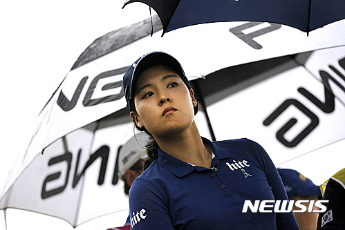 In Gee Chun of South Korea looks on before playing on the 16th hole, during the second round of the Evian Championship women's golf tournament in Evian, eastern France, Friday, Sept. 16, 2016. (AP Photo/Laurent Cipriani)