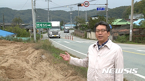 국도 28호선을 조사중인 홍진규 도의원