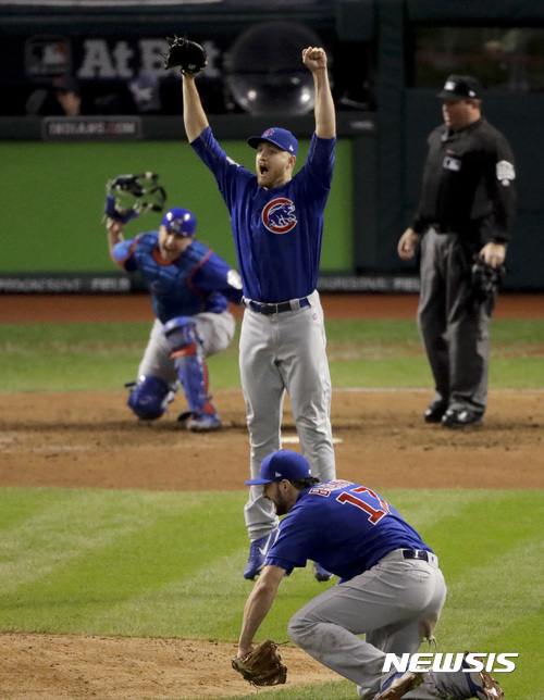 Chicago Cubs relief pitcher Mike Montgomery celebrates after after Game 7 of the Major League Baseball World Series Thursday, Nov. 3, 2016, in Cleveland. The Cubs won 8-7 in 10 innings to win the series 4-3. (AP Photo/Charlie Riedel)