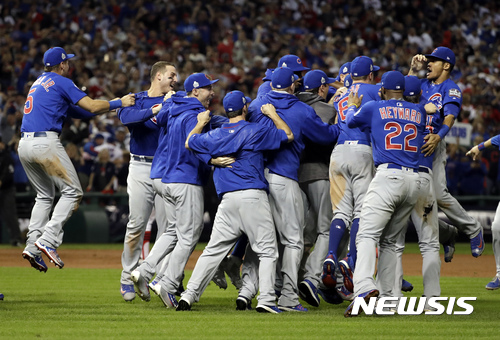 The Chicago Cubs celebrate after Game 7 of the Major League Baseball World Series against the Cleveland Indians Thursday, Nov. 3, 2016, in Cleveland. The Cubs won 8-7 in 10 innings to win the series 4-3. (AP Photo/David J. Phillip)