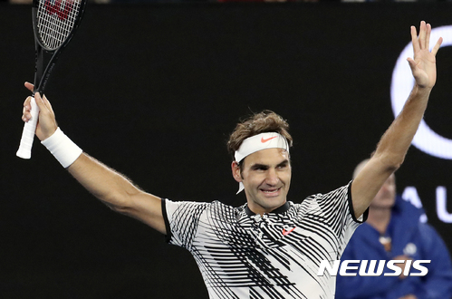 Switzerland's Roger Federer celebrates after defeating Germany's Mischa Zverev during their quarterfinal at the Australian Open tennis championships in Melbourne, Australia, Tuesday, Jan. 24, 2017. (AP Photo/Aaron Favila)
