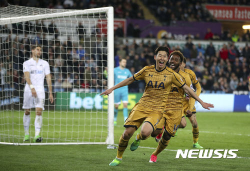 Tottenham Hotspur's Son Heung-Min celebrates scoring his side's second goal of the game during the English Premier League soccer match Swansea City against Tottenham Hotspur's at the Liberty Stadium, Swansea, Wales, Wednesday April 5, 2017. (Nick Potts/PA via AP)
