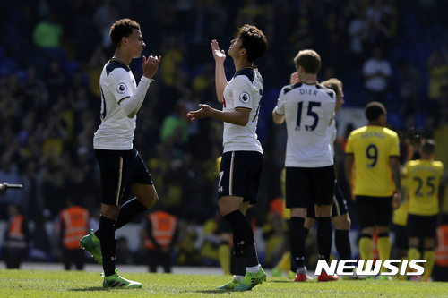 Tottenham's Dele Alli, left, and Tottenham's Son Heung-Min celebrate after the English Premier League soccer match between Tottenham Hotspur and Watford at White Hart Lane in London, Saturday April 8, 2017. (AP Photo/Tim Ireland)
