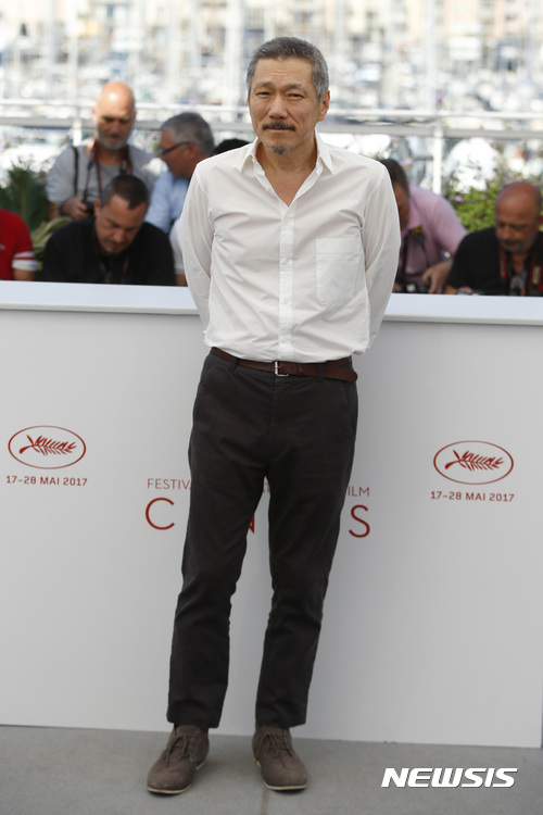 Director Hong SangSoo poses for photographers during the photo call for the film Claire's Camera at the 70th international film festival, Cannes, southern France, Sunday, May 21, 2017. (AP Photo/Alastair Grant)