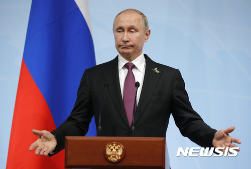 Russian President Vladimir Putin speaks during a press conference after the G-20 summit in Hamburg, northern Germany, Saturday, July 8, 2017, where the leaders of the group of 20 met for two days. (AP Photo/Alexander Zemlianichenko, pool)