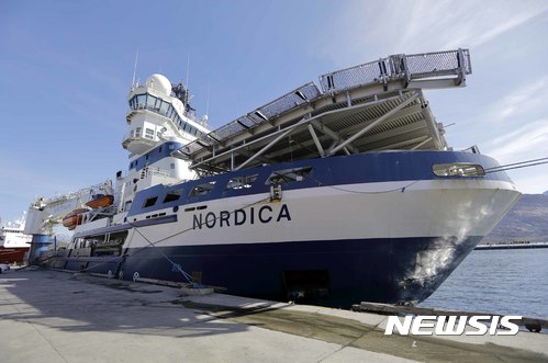 The Finnish icebreaker MSV Nordica is docked in Nuuk, Greenland, after traversing the Northwest Passage through the Canadian Arctic Archipelago, Saturday, July 29, 2017. After 24 days at sea and a journey divning more than 10,000 kilometers (6,214 miles), the MSV Nordica has set a new record for the earliest transit of the fabled Northwest Passage. The once-forbidding route through the Arctic, linking the Pacific and the Atlantic oceans, has been opening up sooner and for a longer period each summer due to climate change. (AP Photo/David Goldman)