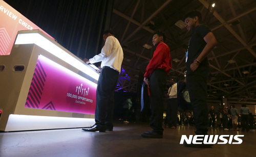 FILE - In this Friday, May 19, 2017, file photo, job seekers line up to check in at the Opportunity Fair and Forum employment event in Dallas. On Thursday, Aug. 10, 2017, the Labor Department reports on the number of people who applied for unemployment benefits a week earlier. (AP Photo/LM Otero, File)