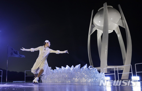 South Korean Olympic figure skating champion Yuna Kim performs before lighting the Olympic flame during the opening ceremony of the 2018 Winter Olympics in Pyeongchang, South Korea, Friday, Feb. 9, 2018. (AP Photo/David J. Phillip,Pool)