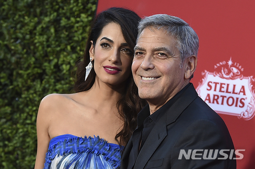 클루니 부부, 총기 규제 시위행진에 50만$ 기부…행진 동참