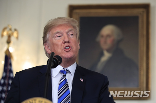 President Donald Trump speaks in the Diplomatic Room of the White House in Washington, Friday, March 23, 2018, about the $1.3 trillion spending bill. (AP Photo/Manuel Balce Ceneta)