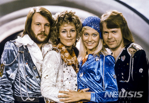 FILE - In this Feb. 9, 1974 file photo Swedish pop group Abba, from left: Benny Andersson, Anni-Frid Lyngstad, Agnetha Faltskog and Bjorn Ulvaeus posing after winning the Swedish branch of the Eurovision Song Contest with their song "Waterloo". The members of ABBA announced Friday April 27, 2018 that they have recorded new material for the first time in 35 years. (Olle Lindeborg/TT NEWS AGENCY via AP)