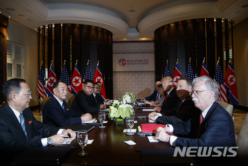 President Donald Trump meets with North Korean leader Kim Jong Un on Sentosa Island, Tuesday, June 12, 2018, in Singapore. (AP Photo/Evan Vucci)