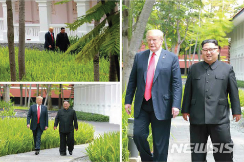 【서울=뉴시스】 북한 노동신문은 지난 12일 김정은 국무위원장이 도널드 트럼프 대통령과 싱가포르 센토사섬 카펠라 호텔에서 북미정상회담을 한 모습을 13일 보도했다. 2018.06.13. (출처=노동신문) photo@newsis.com