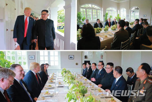 【서울=뉴시스】 북한 노동신문은 지난 12일 김정은 국무위원장이 도널드 트럼프 대통령과 싱가포르 센토사섬 카펠라 호텔에서 북미정상회담을 한 모습을 13일 보도했다. 2018.06.13. (출처=노동신문) photo@newsis.com