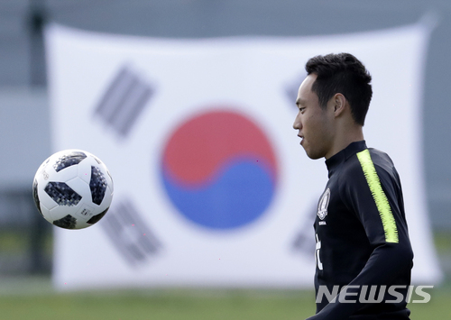 South Korea's Moon Seon-min controls the ball during a training session of South Korea at the 2018 soccer World Cup at the Spartak Stadium in Lomonosov near St. Petersburg, Russia, Wednesday, June 20, 2018. (AP Photo/Lee Jin-man)