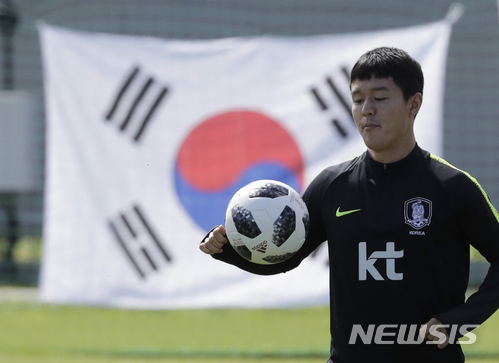 South Korea's Ju Se-jong controls the ball during a training session of South Korea at the 2018 soccer World Cup at the Spartak Stadium in Lomonosov near St. Petersburg, Russia, Wednesday, June 20, 2018. (AP Photo/Lee Jin-man)