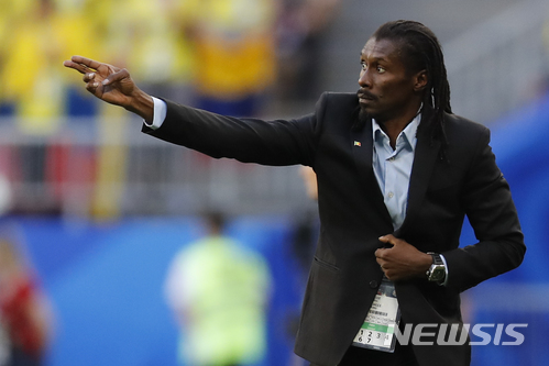 Senegal coach Aliou Cisse gestures during the group H match between Senegal and Colombia, at the 2018 soccer World Cup in the Samara Arena in Samara, Russia, Thursday, June 28, 2018. (AP Photo/Efrem Lukatsky)