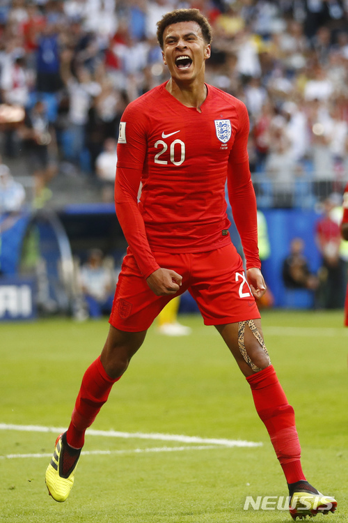 England's Dele Alli celebrates after scoring his side's second goal during the quarterfinal match between Sweden and England at the 2018 soccer World Cup in the Samara Arena, in Samara, Russia, Saturday, July 7, 2018. (AP Photo/Matthias Schrader ) 