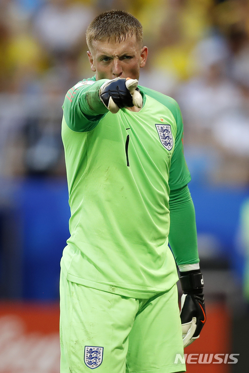 England goalkeeper Jordan Pickford reacts during the quarterfinal match between Sweden and England at the 2018 soccer World Cup in the Samara Arena, in Samara, Russia, Saturday, July 7, 2018. (AP Photo/Francisco Seco) 