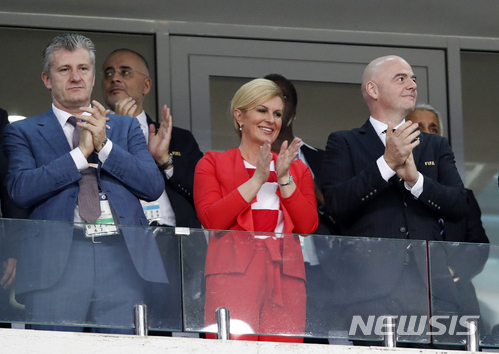 Croatia&#039;s President Kolinda Grabar-Kitarovic, center, applauds prior the quarterfinal match between Russia and Croatia at the 2018 soccer World Cup in the Fisht Stadium, in Sochi, Russia, Saturday, July 7, 2018. (AP Photo/Rebecca Blackwell)