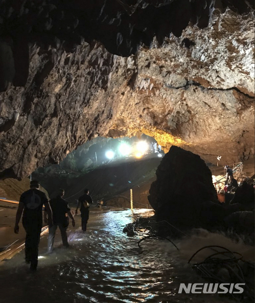 This photo tweeted by Elon Musk shows efforts underway to rescue trapped members of a youth soccer team from a flooded cave in northern Thailand. Musk tweeted early Tuesday, July 10, 2018, he has visited the cave and has left a mini-submarine there for future use. (Courtesy of Elon Musk via AP)