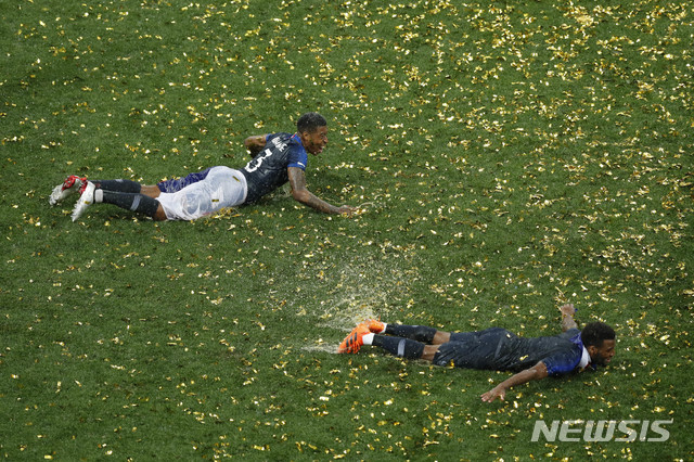 France players celebrate at the end of the final match between France and Croatia at the 2018 soccer World Cup in the Luzhniki Stadium in Moscow, Russia, Sunday, July 15, 2018. (AP Photo/Rebecca Blackwell)