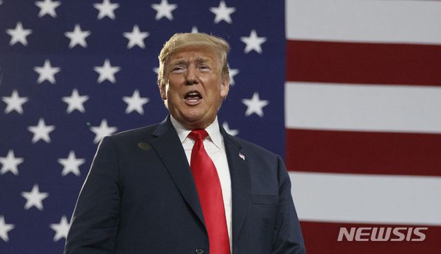 FILE - In this Saturday, Aug. 4, 2018 file photo, President Donald Trump speaks at a rally at Olentangy Orange High School in Lewis Center, Ohio. Showtime will air a new documentary series from award-winning filmmaker Alex Gibney examining the history of clashes between U.S. presidents and the FBI. The four-part series inspired by the book "Enemies: A History of the FBI" by Tim Weiner will debut Nov. 18, 2018, Showtime Networks chief David Nevins told TV critics' Monday, Aug. 6. (AP Photo/Carolyn Kaster, File)