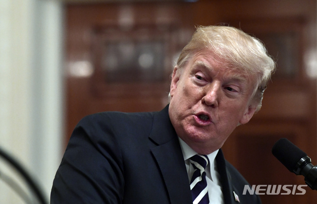 President Donald Trump speaks during a news conference with Polish President Andrzej Duda in the East Room of the White House in Washington, Tuesday, Sept. 18, 2018. (AP Photo/Susan Walsh)