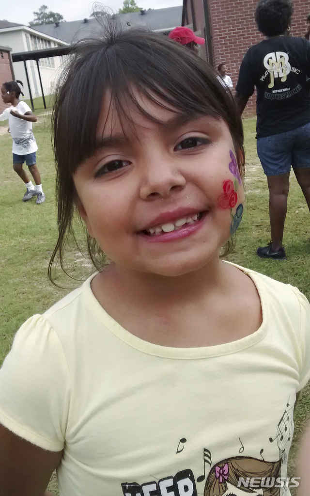 In this undated photo provided by Amber Radney, 11-year-old Sarah Radney poses for a photo at her school, in Grady County near Cairo, Ga. Sarah Radney died during Hurricane Michael. In what could only be described as a freak accident, authorities say Michael's powerful winds lifted a carport high into the air and slammed it back down on the house. When it landed, one of the legs tore through the roof, fatally striking the 11-year-old girl in the head. (Amber Radney via AP)