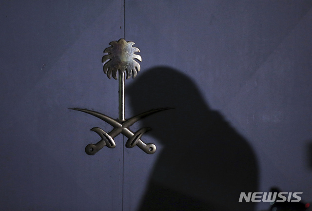 A Turkish forensic officer arrives at the Saudi consulate to conduct a new search over the disappearance and alleged slaying of Saudi writer Jamal Khashoggi, in Istanbul, early Thursday, Oct. 18, 2018. Pro-government newspaper Yeni Safak on Wednesday said it had obtained audio recordings of the alleged killing of Saudi writer Jamal Khashoggi inside the Saudi Arabia's consulate in Istanbul on Oct. 2. (AP Photo/Emrah Gurel)