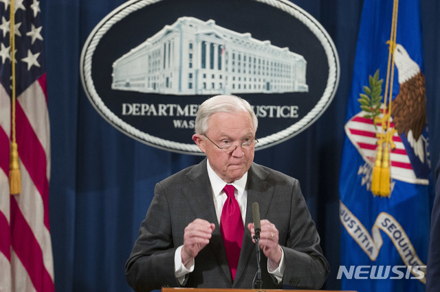Attorney General Jeff Sessions pauses before speaking about the arrest of Cesar Sayoc, 56, of Aventura, Fla., in the package bomb case, during a news conference at the Department of Justice, Friday, Oct. 26, 2018, in Washington. (AP Photo/Alex Brandon)