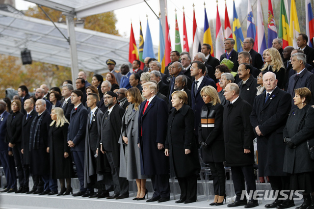 Heads of states and world leaders attend ceremonies at the Arc de Triomphe Sunday, Nov. 11, 2018 in Paris. Over 60 heads of state and government were taking part in a solemn ceremony at the Tomb of the Unknown Soldier, the mute and powerful symbol of sacrifice to the millions who died from 1914-18. (AP Photo/Francois Mori, Pool)