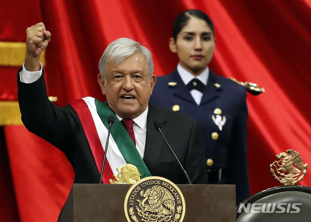 Mexico's new President Andres Manuel Lopez Obrador speaks during his inaugural ceremony at the National Congress in Mexico City, Saturday, Dec. 1, 2018. (AP Photo/Eduardo Verdugo)