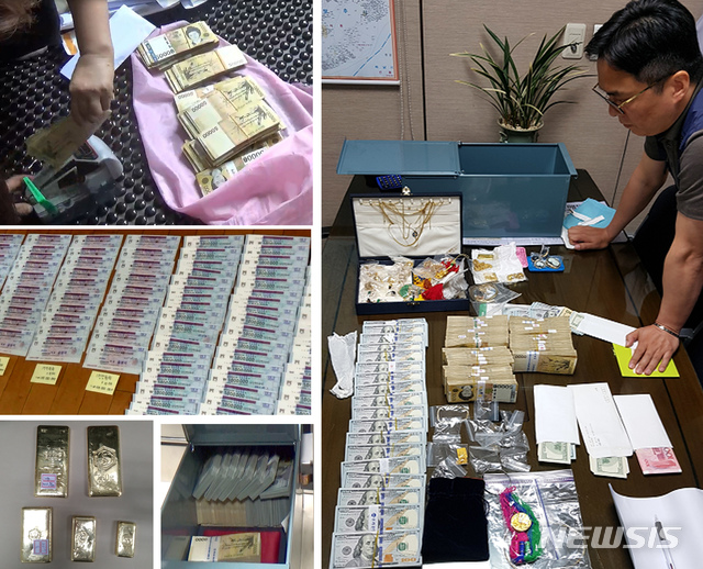 [세종=뉴시스] 강종민 기자 = 국세청이 고액·상습 체납자에게서 징수한 현금·수표·금괴 등. (사진=국세청 제공) photo@newsis.com 이 사진은 기사 내용과 직접적 관련 없음