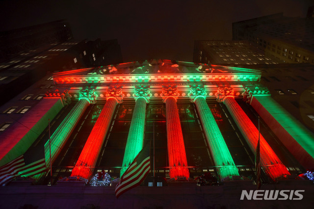 This photo shows the exterior of the New York Stock Exchange on Thursday evening, Dec. 20, 2018. Stocks went into another slide Thursday in what is shaping up as the worst December on Wall Street since the depths of the Great Depression, with prices dragged down by rising fears of a recession somewhere on the horizon. The Dow Jones Industrial Average dropped 464 points, bringing its losses to more than 1,700 since last Friday. (AP Photo/Patrick Sison)